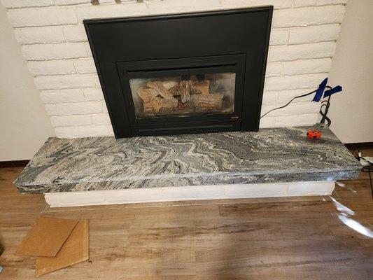 Fireplace hearth just installed and caulked.