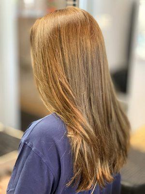 Long layers haircut with natural highlights