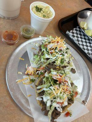 Homemade Asada Sopes and Rice on the side. Red and Green Salsa was freshly made.