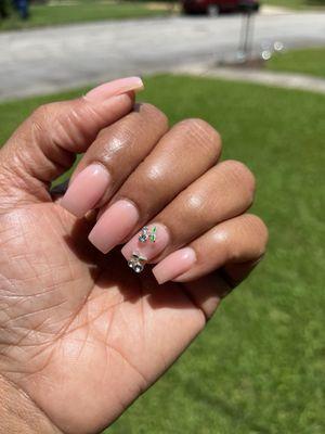This is my go to nail color and I switch up the gems between flowers or cherries; I've also had a bow and 3D flower done.