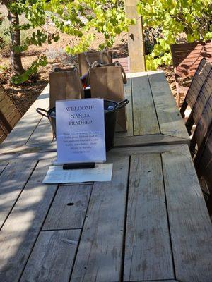 Table set with wine bottles.