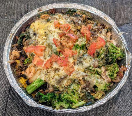 Savory yellow rice with grilled veggies, three cheeses, diced tomatoes, hot sauce, cucumber sauce, and grilled lamb & chicken