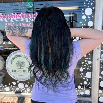 Hair extensions with teal ombre extensions mixed in