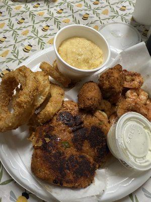 Combo of 2 (deviled crab and grilled shrimp) cheese grits and onion rings