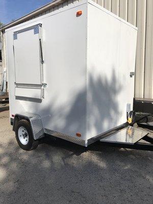 A 6' x 8' Food Concession Trailer, side window.