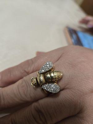 Different angle of my mother's awesome high end queen bee ring with ruby eyes and diamond wings!