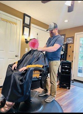 The barber-stylist explaining the process...