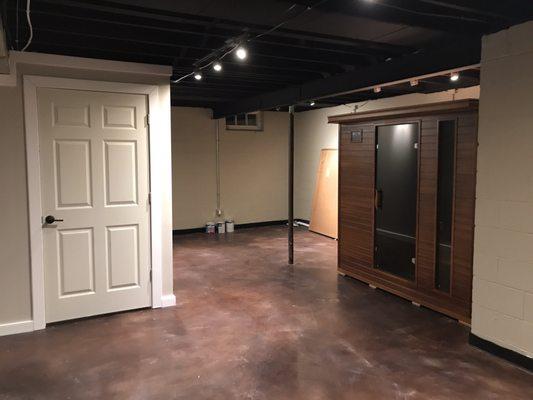 AFTER - new basement interior paint, dryloc basement wall waterproofing paint, black basement ceiling paint, basement door finish and paint