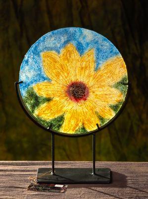 The sunflowers from Ukraine. Wool fibers sewn together, mounted on glass.