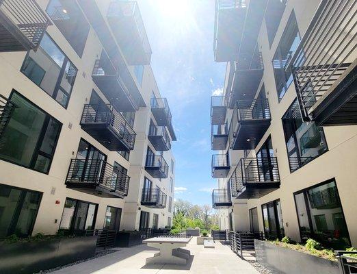 The Olive's beautiful 2nds floor community courtyard - Play Ping Pong, Cornhole or BBQ with friends and family!