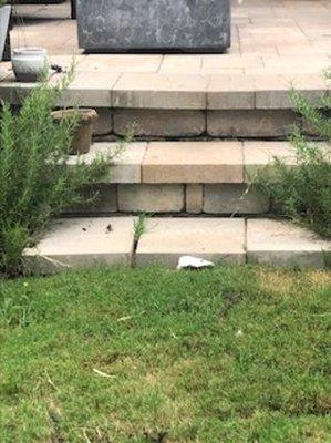 Separating step and caving in patio