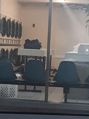 You see the person sleeping on the floor? You see the shoes? It's a laundry hostel!