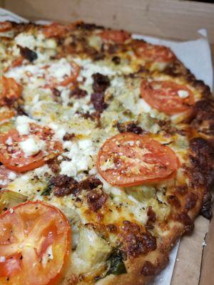 Oasis with creamy garlic sauce, added bacon and cooked tomatoes.