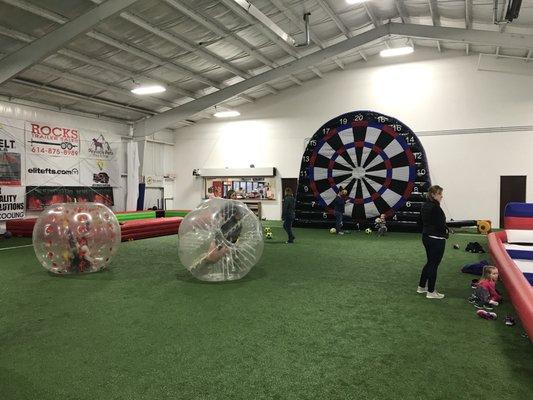 Soccer billiards, hamster balls, and Velcro giant dartboard.