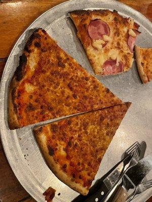 Burnt cheese pizza with a cracker crust. I did not ask for thin crust.