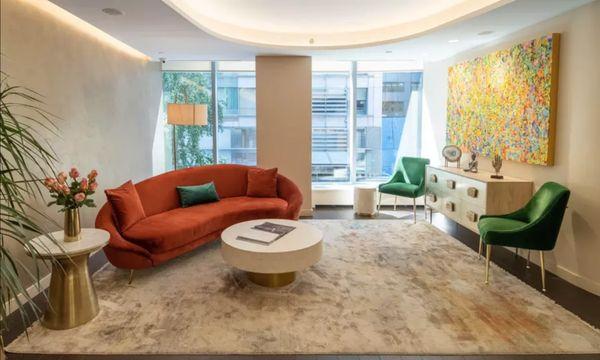 The waiting area in a salon is a designated space where clients can relax and wait for their appointments.