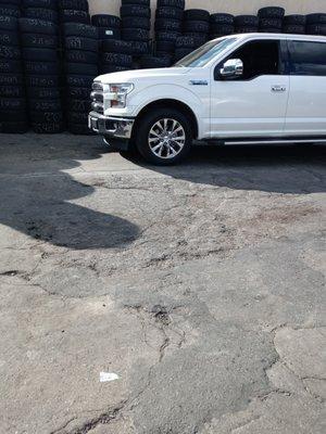 truck needing tire. Wheel lugnuts-fancy, but fancy cap is a problem when taking them off.