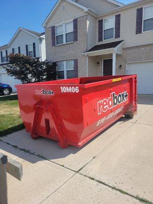 10 yard "mini" dumpster on a residential driveway.