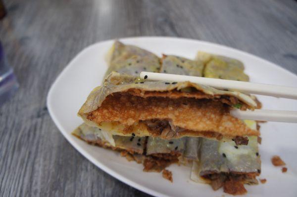 Roasted duck pancake with crispy wonton skin inside