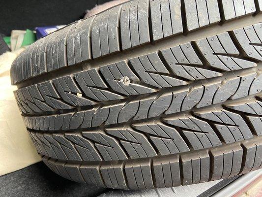 Nail caused slow leak resulting in having to drive on under inflated tire