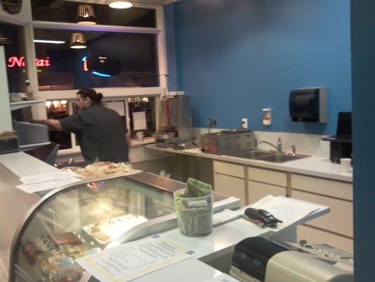 working the grill and the street window at the same time