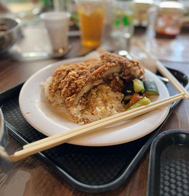 Fried pork chop over rice
