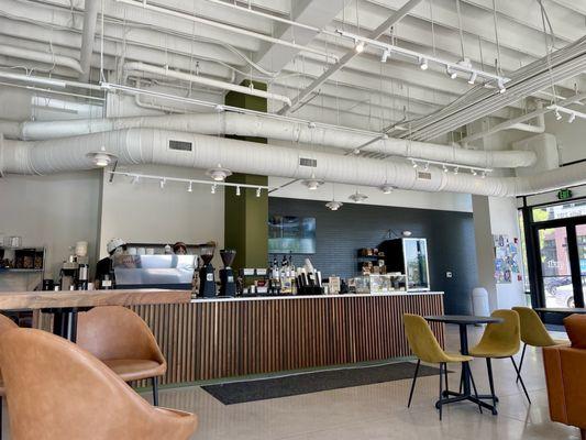 Inside / Interior of shop facing ordering counter - VERY spacious, open, clean & neat with comfy seating, tables to work, ample free parking