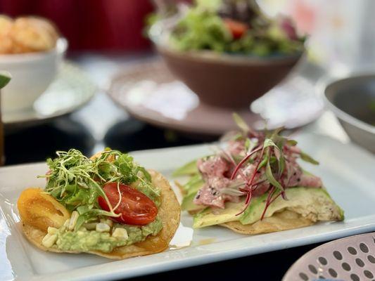 Tostada bites, one vegetarian, the other with tuna tartare