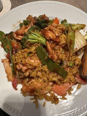 Half of the portion of chicken and vegetables with pork fried rice