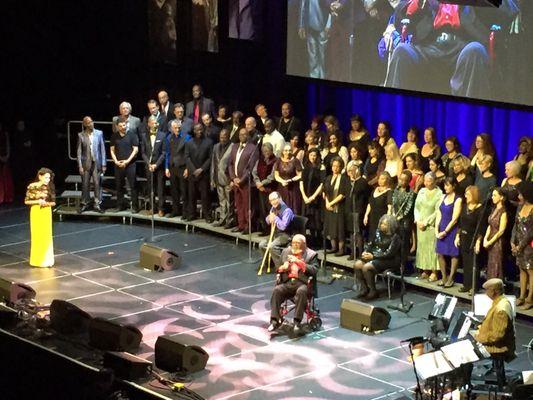 Cecil Williams fronting the GLIDE Ensemble. The event features food, drink, tons of music, & a lot of love.