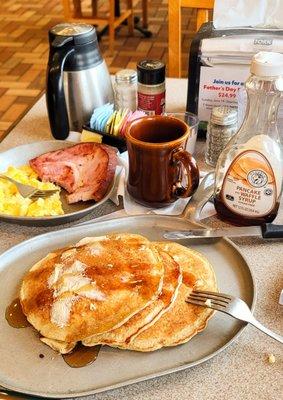 Pancake combo light fluffy yummy pancakes Sugar-free syrup. Scrambled eggs and a hunk of ham Yummers! Cawfee