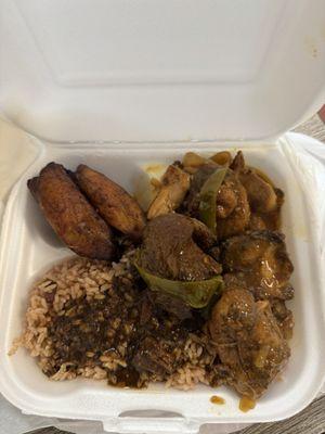 Brown stew chicken, fried plantains with rice and peas