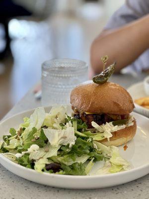 Spicy fried chicken sandwich with salad