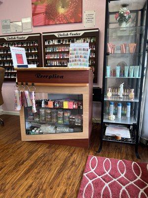 In front the nail polishes display and other different color nails