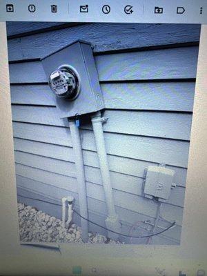 Electric box .The meter socket has settled and shifted, causing it to become tilted.