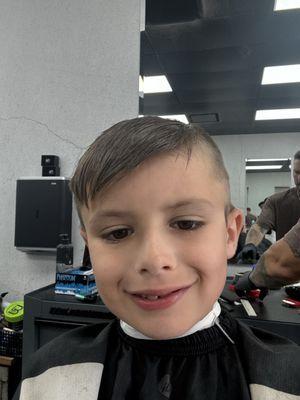 The barber giving me the fade haircut.