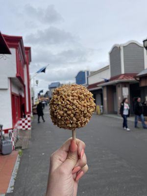 I hold a caramel apple, showing off my gel acrylic nails