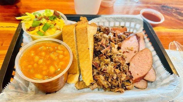 Sausage, chopped brisket, bake beans, twice baked potatoes & Texas Toast