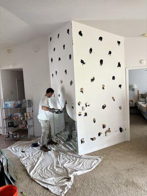 Finishing up the second wall of mirror that they removed