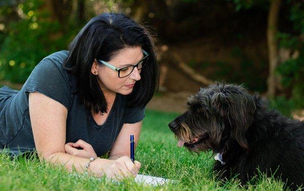 I am a doggie fanatic, having fun with a clients dog