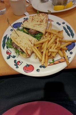 Flank steak sandwich on naan bread, horseradish aioli, seasoned french fries - delicious.