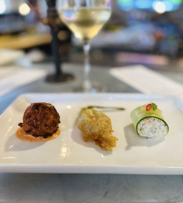 A trio of bites: (left to right) Corn Beignet, Squash Blossom, Blue Crab Salad
