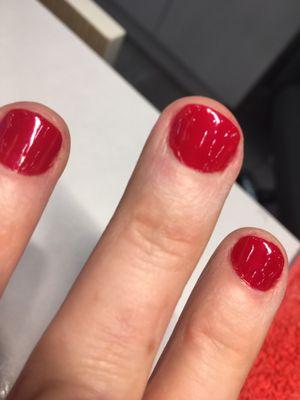 Horrid job, misshapen, polish on cuticles and surrounding skin