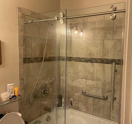 My newly installed frameless shower door.