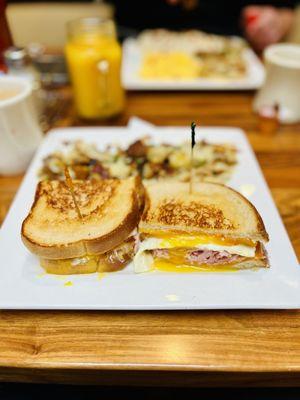 Breakfast Sandwich with ham and eggs sunny side up.