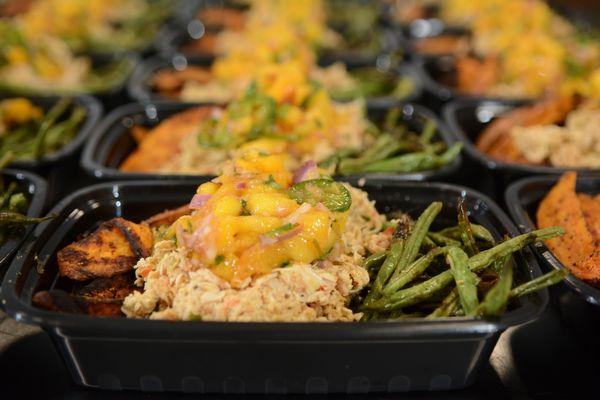 Pulled Carribean chicken with mango salsa with roasted green beans and sweet potato fries.