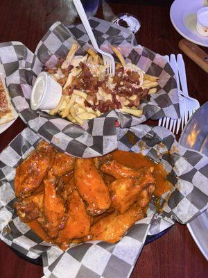 Amazing wings with extra sauce but still crispy and cheese fries with bacon was delicious