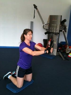 Achieve Health and Fitness Client Marylou C. training her core.