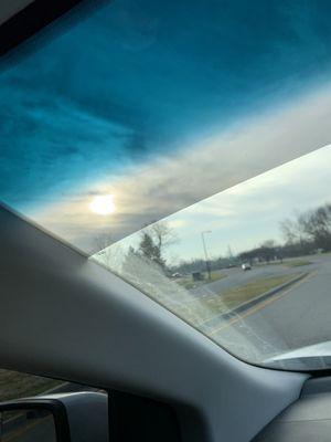 Front windshield tinted strip. Love it. It's perfect for when the sun gets in the smallest places your visors don't block.