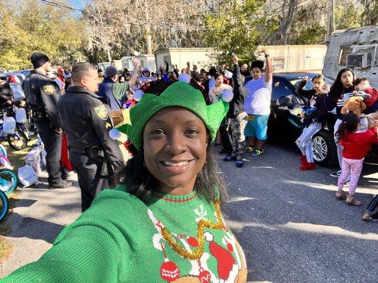 Our founder spreading joy in partnership with Toys for Tots and local law enforcement officers.